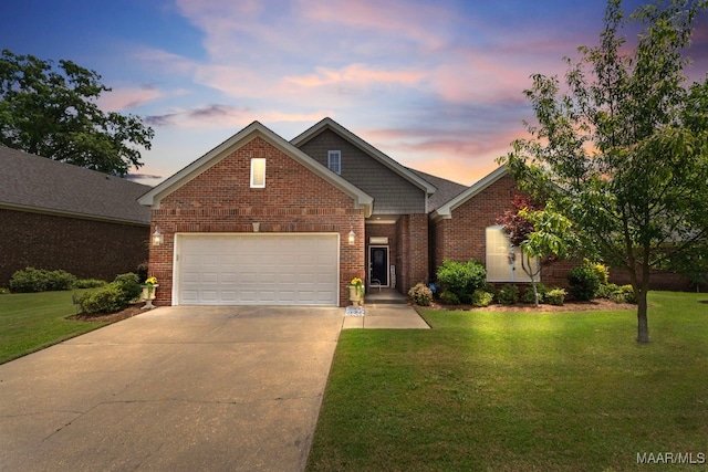 1900 Wyndgate Loop, Montgomery, AL 36117 - view of front of property with driveway, an attached garage, a front lawn, and brick siding