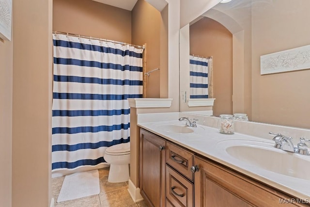 1900 Wyndgate Loop, Montgomery, AL 36117 - full bathroom featuring toilet, tile patterned flooring, double vanity, and curtained shower