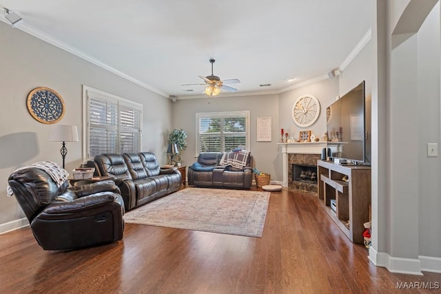 1900 Wyndgate Loop, Montgomery, AL 36117 - living room featuring crown molding, ceiling fan, a fireplace, baseboards, and wood finished floors