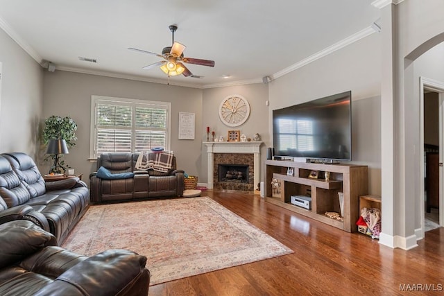 1900 Wyndgate Loop, Montgomery, AL 36117 - living room with a ceiling fan, arched walkways, wood finished floors, crown molding, and a high end fireplace