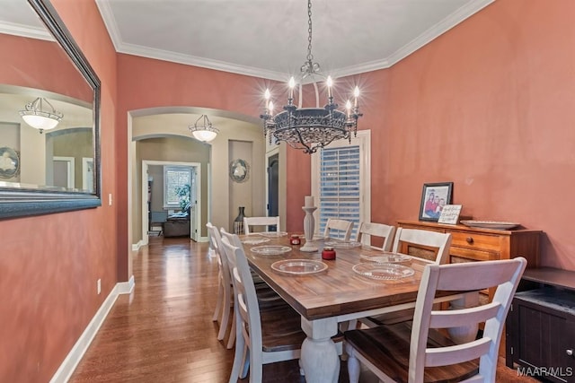 1900 Wyndgate Loop, Montgomery, AL 36117 - dining room with arched walkways, wood finished floors, crown molding, a chandelier, and baseboards