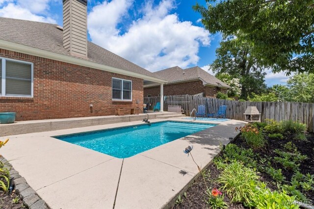 1900 Wyndgate Loop, Montgomery, AL 36117 - view of swimming pool featuring a patio and a fenced backyard
