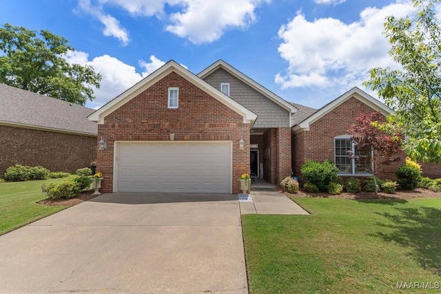 1900 Wyndgate Loop, Montgomery, AL 36117 - view of front facade with driveway, a front yard, an attached garage, and brick siding