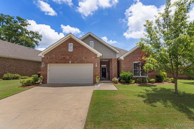 1900 Wyndgate Loop, Montgomery, AL 36117 - view of front of property with driveway, a garage, a front lawn, and brick siding