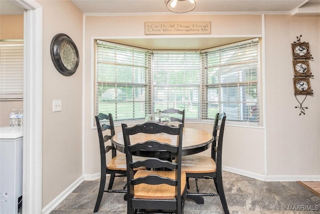 1505 Terrace Ct, Opelika, AL 36081 - dining area with crown molding, stone finish floors, and baseboards
