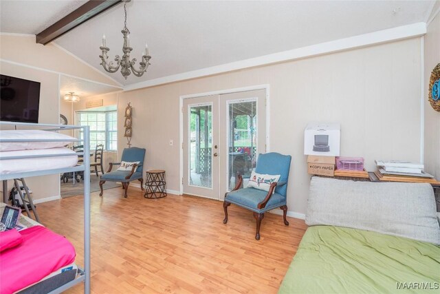 1505 Terrace Ct, Opelika, AL 36081 - bedroom featuring a chandelier, access to outside, wood finished floors, and multiple windows
