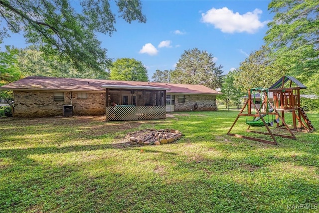 1505 Terrace Ct, Opelika, AL 36081 - view of green lawn with a playground, a sunroom, and cooling unit