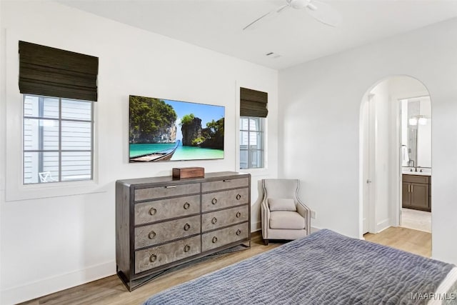 4808 Clerkenwell St, Montgomery, AL 36116 - bedroom featuring multiple windows, arched walkways, wood finished floors, and baseboards