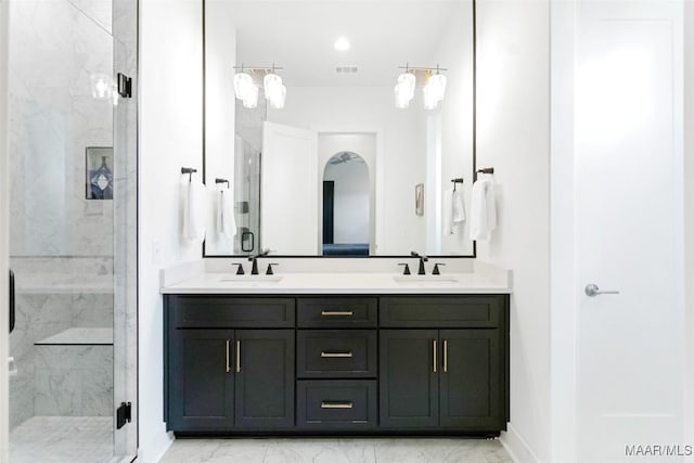 4808 Clerkenwell St, Montgomery, AL 36116 - bathroom featuring marble finish floors, a marble finish shower, double vanity, and baseboards