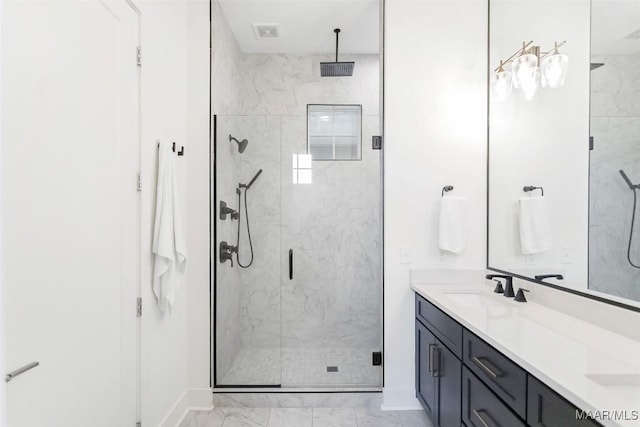 4808 Clerkenwell St, Montgomery, AL 36116 - bathroom with marble look tile flooring, a marble finish shower, double vanity, and baseboards