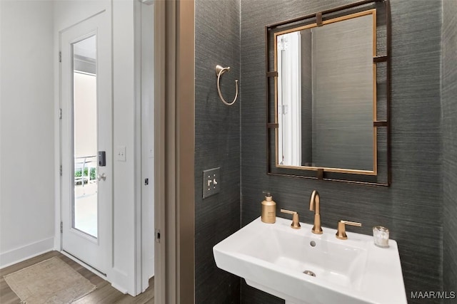 4808 Clerkenwell St, Montgomery, AL 36116 - bathroom featuring wood finished floors, baseboards, and a sink