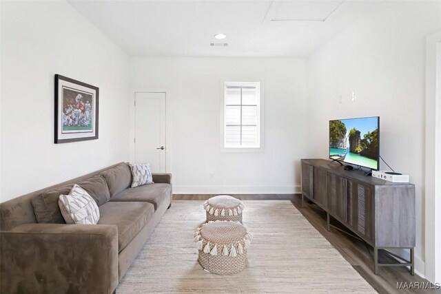 4808 Clerkenwell St, Montgomery, AL 36116 - living area featuring attic access, dark wood finished floors, and baseboards