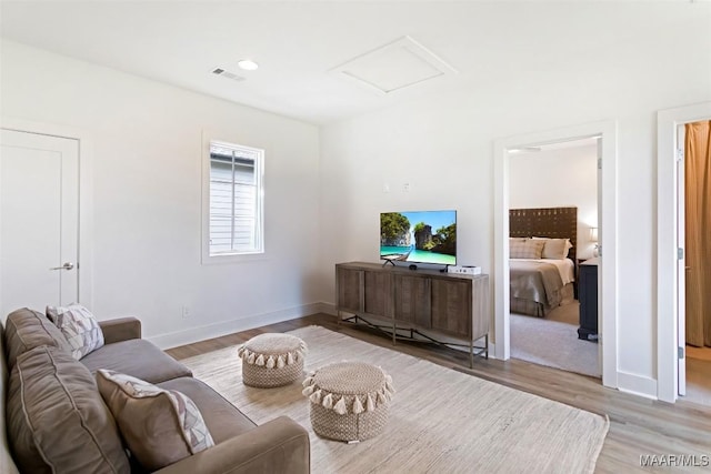 4808 Clerkenwell St, Montgomery, AL 36116 - living area featuring attic access, wood finished floors, and baseboards