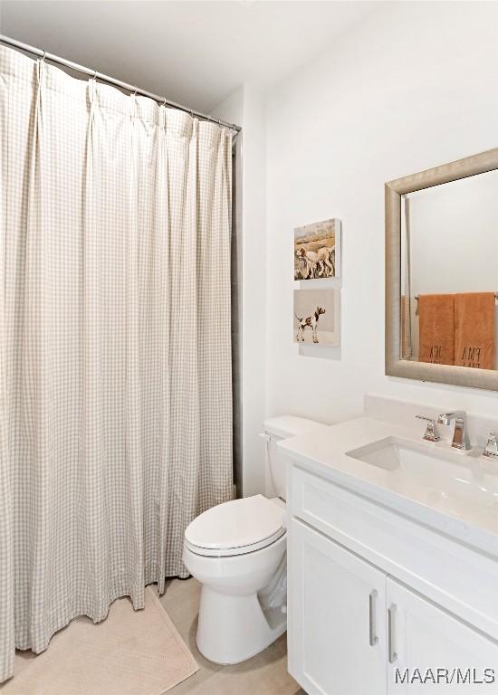 4808 Clerkenwell St, Montgomery, AL 36116 - bathroom with vanity, toilet, and curtained shower