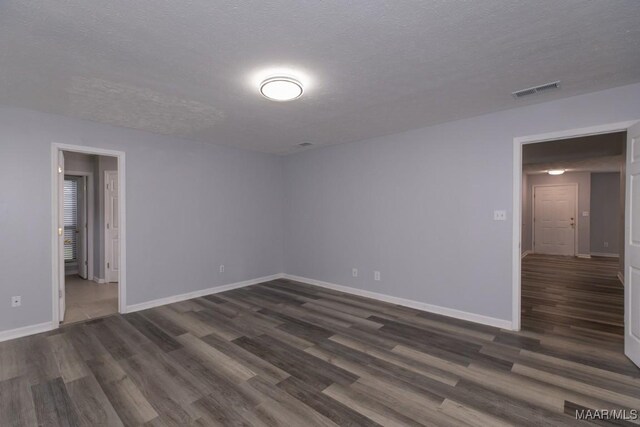 355 Hambleton Ct, Montgomery, AL 36117 - empty room featuring dark wood finished floors, baseboards, and a textured ceiling