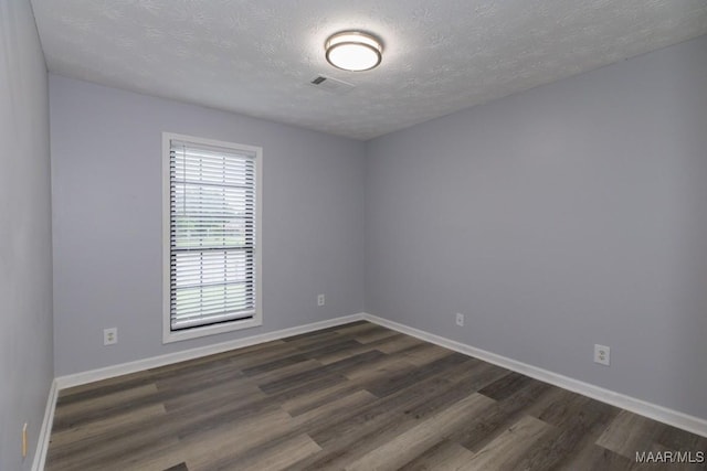 355 Hambleton Ct, Montgomery, AL 36117 - unfurnished room with dark wood-style floors, baseboards, and a textured ceiling