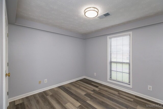355 Hambleton Ct, Montgomery, AL 36117 - empty room featuring dark wood-style flooring, a textured ceiling, and baseboards