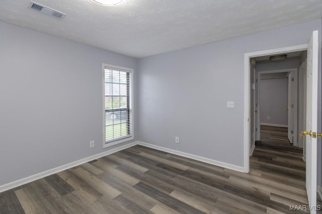 355 Hambleton Ct, Montgomery, AL 36117 - spare room featuring dark wood-style flooring, baseboards, and a textured ceiling