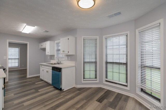 355 Hambleton Ct, Montgomery, AL 36117 - kitchen featuring dishwasher, a sink, baseboards, dark wood-style flooring, and white cabinetry