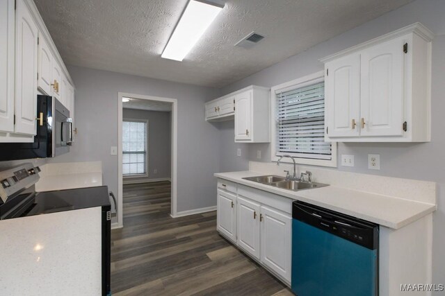 355 Hambleton Ct, Montgomery, AL 36117 - kitchen with dishwasher, electric range, a sink, dark wood-style floors, and white cabinetry
