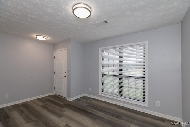 355 Hambleton Ct, Montgomery, AL 36117 - empty room with dark wood-style flooring, baseboards, and a textured ceiling