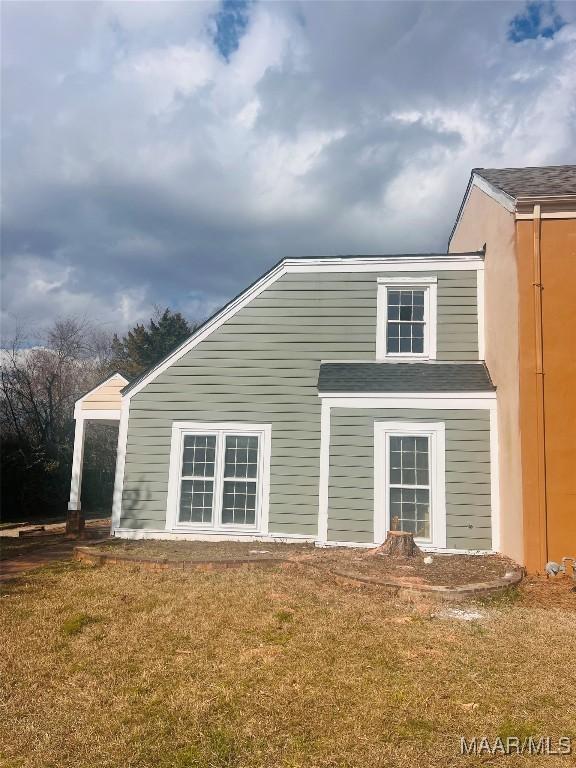 6723 Greenbrook Dr, Montgomery, AL 36117 - rear view of house featuring a lawn