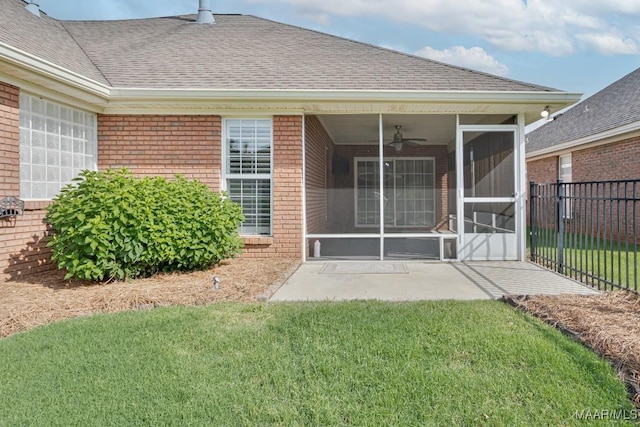 8115 Bridgewater Trce, Montgomery, AL 36117 - back of property featuring brick siding, a sunroom, a ceiling fan, and roof with shingles