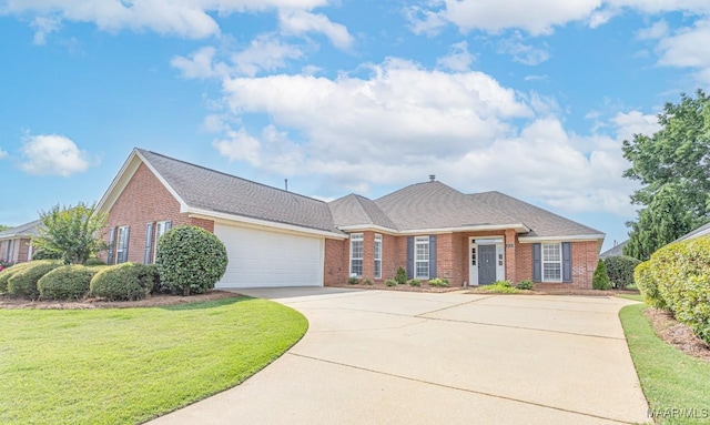 8115 Bridgewater Trce, Montgomery, AL 36117 - view of front facade with brick siding, driveway, a garage, and a front lawn