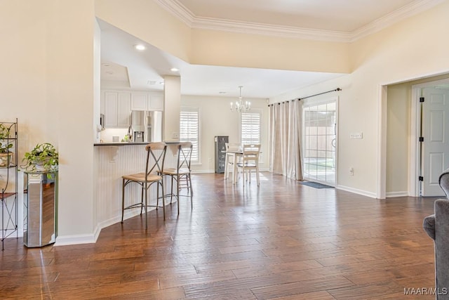 8115 Bridgewater Trce, Montgomery, AL 36117 - living room with a chandelier, crown molding, dark wood-style floors, baseboards, and recessed lighting