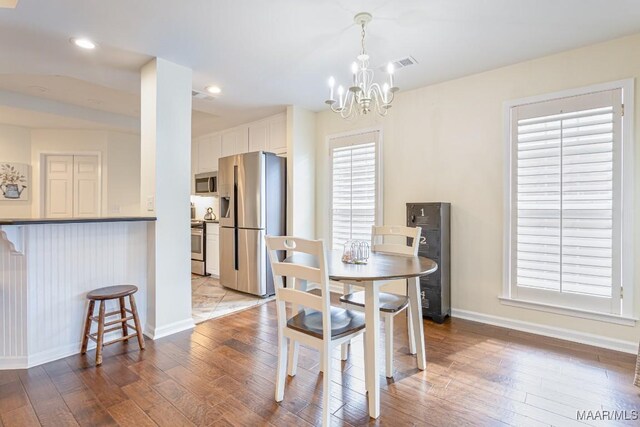 8115 Bridgewater Trce, Montgomery, AL 36117 - dining room with a chandelier, hardwood / wood-style floors, baseboards, and recessed lighting