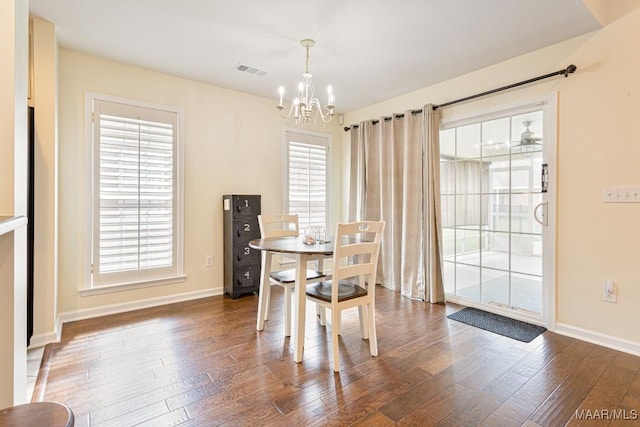 8115 Bridgewater Trce, Montgomery, AL 36117 - dining room featuring a chandelier, baseboards, healthy amount of natural light, and wood finished floors