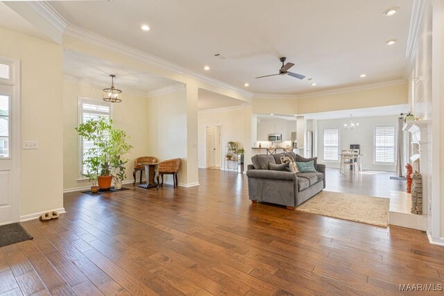 8115 Bridgewater Trce, Montgomery, AL 36117 - living room featuring a chandelier, hardwood / wood-style floors, a ceiling fan, crown molding, and recessed lighting