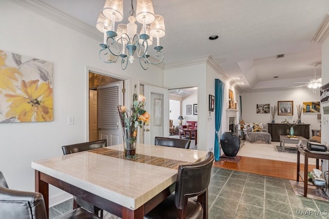 530 Old Mitylene Ct, Montgomery, AL 36117 - dining space with ceiling fan, a chandelier, and crown molding