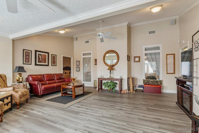 530 Old Mitylene Ct, Montgomery, AL 36117 - living area with ceiling fan, crown molding, wood finished floors, a textured ceiling, and high vaulted ceiling