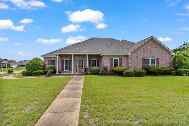 530 Old Mitylene Ct, Montgomery, AL 36117 - view of front facade with brick siding, a front lawn, and roof with shingles
