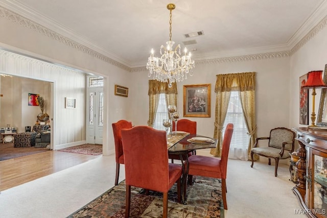 530 Old Mitylene Ct, Montgomery, AL 36117 - dining space featuring a chandelier, light carpet, and crown molding
