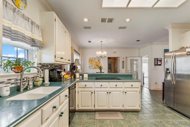 530 Old Mitylene Ct, Montgomery, AL 36117 - kitchen featuring stainless steel fridge, a sink, a peninsula, tasteful backsplash, and dark countertops