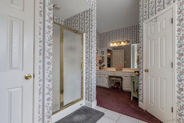 530 Old Mitylene Ct, Montgomery, AL 36117 - full bath with wallpapered walls, a shower stall, vanity, and tile patterned flooring