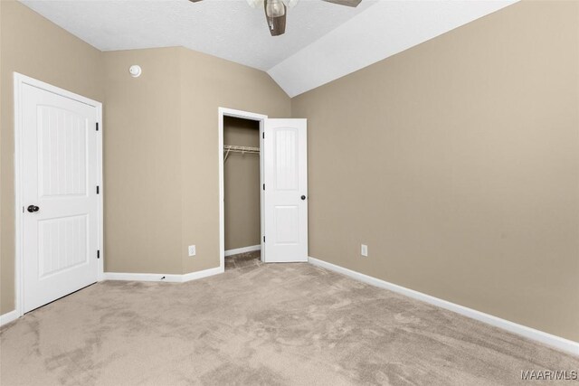 9000 Finsburry Ct, Montgomery, AL 36117 - unfurnished bedroom featuring light carpet, baseboards, lofted ceiling, a closet, and ceiling fan