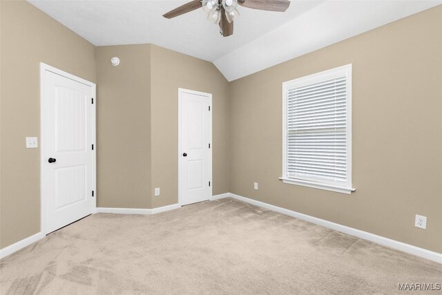 9000 Finsburry Ct, Montgomery, AL 36117 - unfurnished bedroom with light colored carpet, baseboards, lofted ceiling, and a ceiling fan