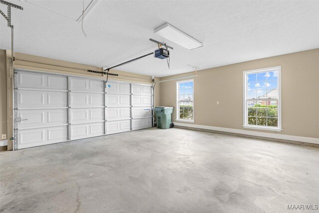 9000 Finsburry Ct, Montgomery, AL 36117 - garage with a garage door opener and baseboards