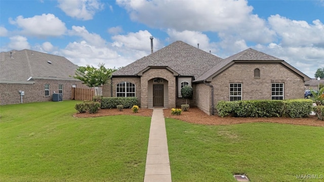 9000 Finsburry Ct, Montgomery, AL 36117 - french country home featuring brick siding, central AC unit, and a shingled roof