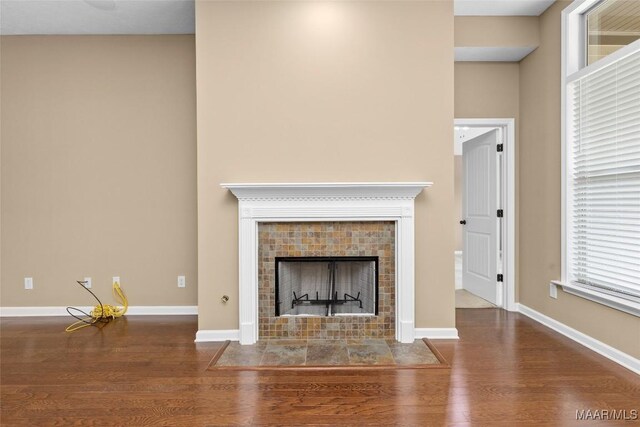 9000 Finsburry Ct, Montgomery, AL 36117 - detailed view of wood finished floors, baseboards, and a tile fireplace