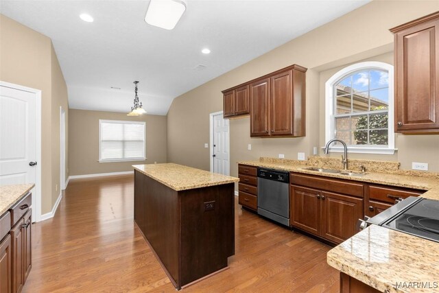 9000 Finsburry Ct, Montgomery, AL 36117 - kitchen featuring stainless steel dishwasher, a sink, wood finished floors, a center island, and light stone countertops