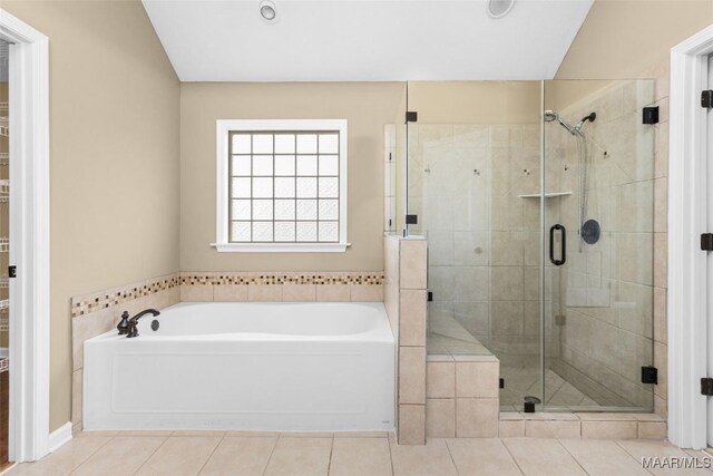 9000 Finsburry Ct, Montgomery, AL 36117 - bathroom with a bath, a shower stall, tile patterned floors, and a spacious closet
