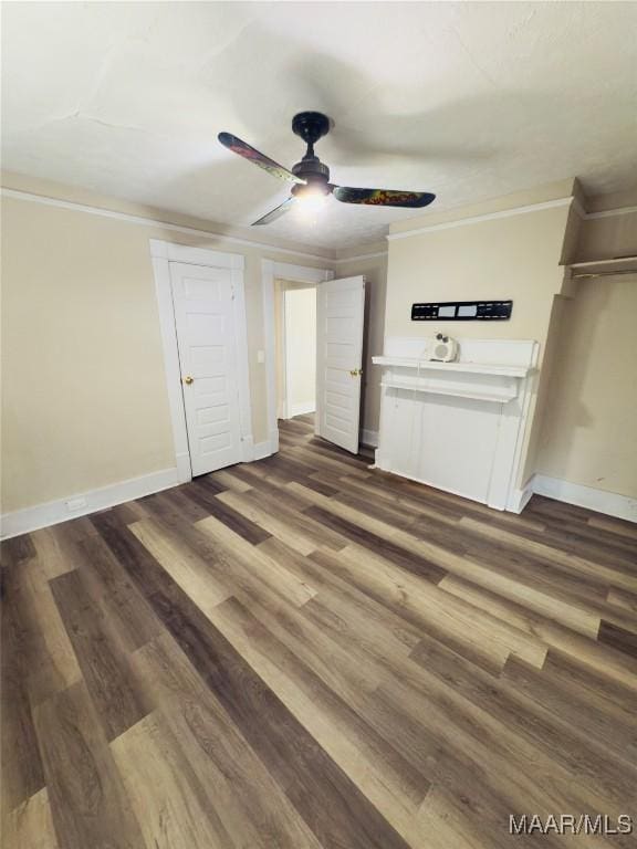 2829 Highland Ave, Montgomery, AL 36107 - unfurnished living room featuring crown molding, ceiling fan, baseboards, and dark wood-style flooring