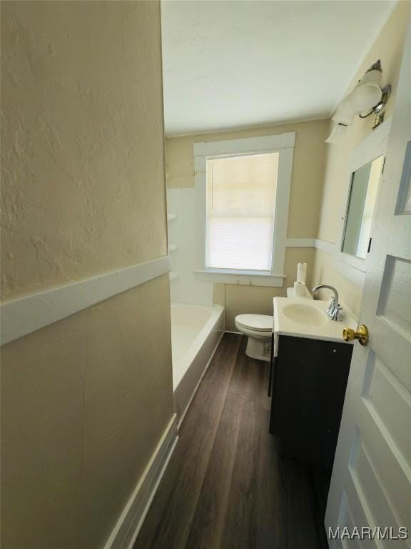 2829 Highland Ave, Montgomery, AL 36107 - full bath featuring vanity, a tub, wood finished floors, toilet, and a shower