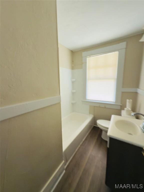 2829 Highland Ave, Montgomery, AL 36107 - bathroom featuring vanity, wood finished floors, and toilet