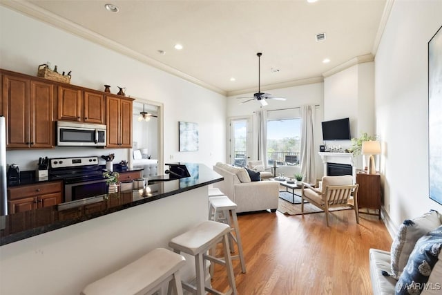 48 Stoneview Summit Ct Unit 2505, Dadeville, AL 36853 - kitchen with stainless steel appliances, crown molding, a ceiling fan, dark countertops, and recessed lighting