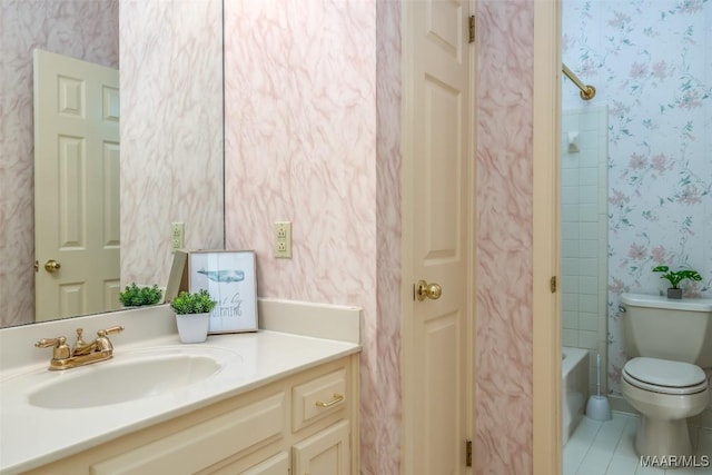 3049 Fieldcrest Dr, Montgomery, AL 36106 - bathroom with wallpapered walls, vanity, toilet, bathtub / shower combination, and tile patterned flooring